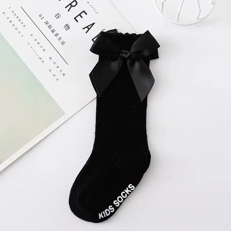 Røde knæstrømper med sløjfe til spædbørn og småbørn